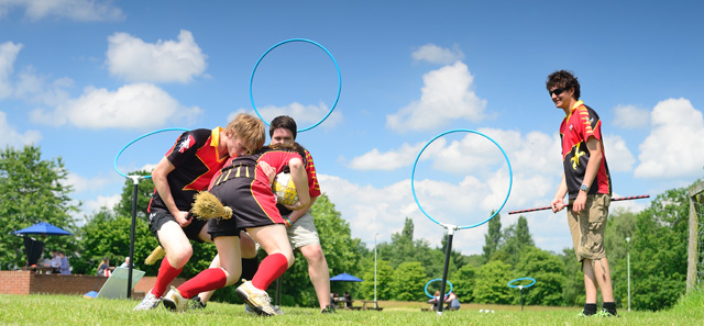 Photo: Students at the University of Reading play muggle quidditch.